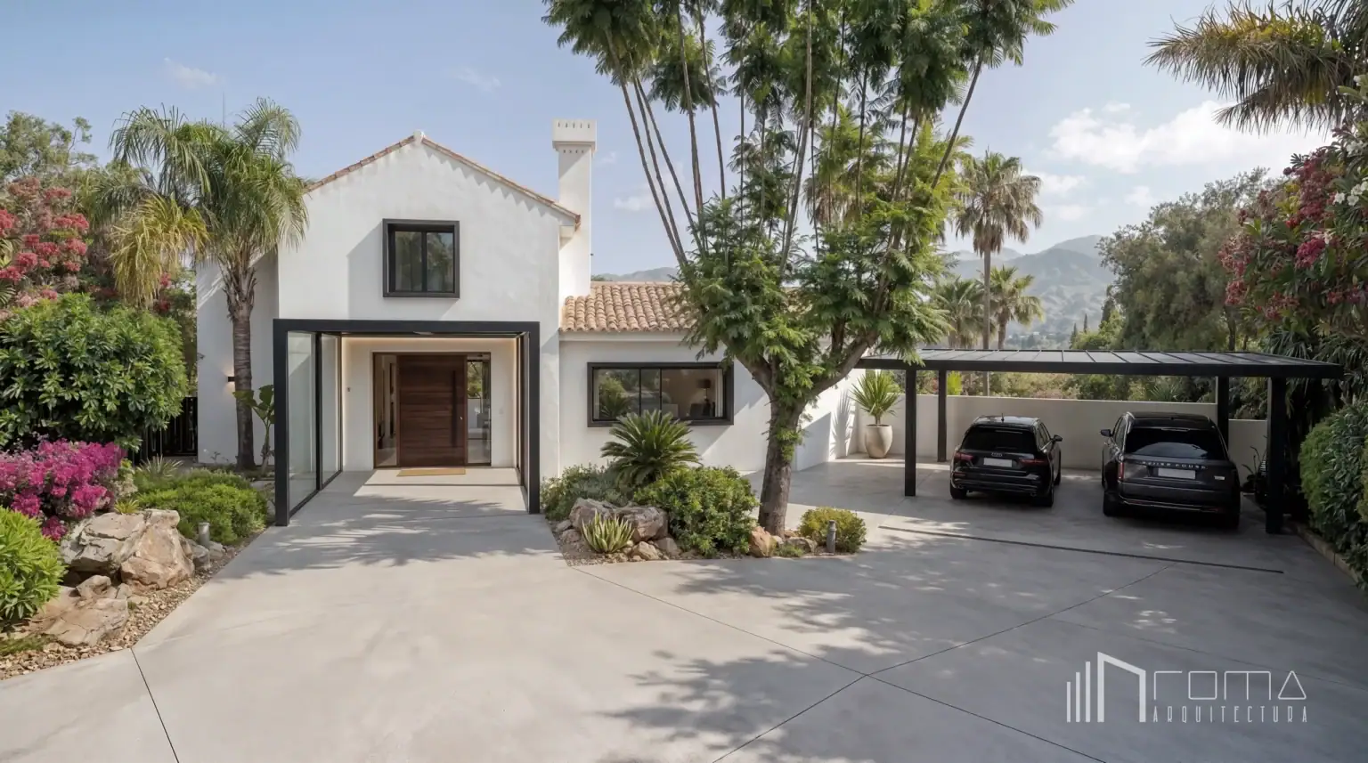 Modernised mediterranean villa entrance featuring glazed pivot door, landscaped driveway, and covered carport, delivered by roma arquitectura studio, leading sotogrande luxury architecture firm.