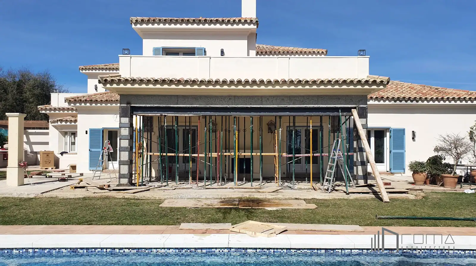 Home 6 Golf villa renovation in la reserva, sotogrande. Architects specializing in modern design and luxury home interiors. Rear porch and swimming pool during renovation