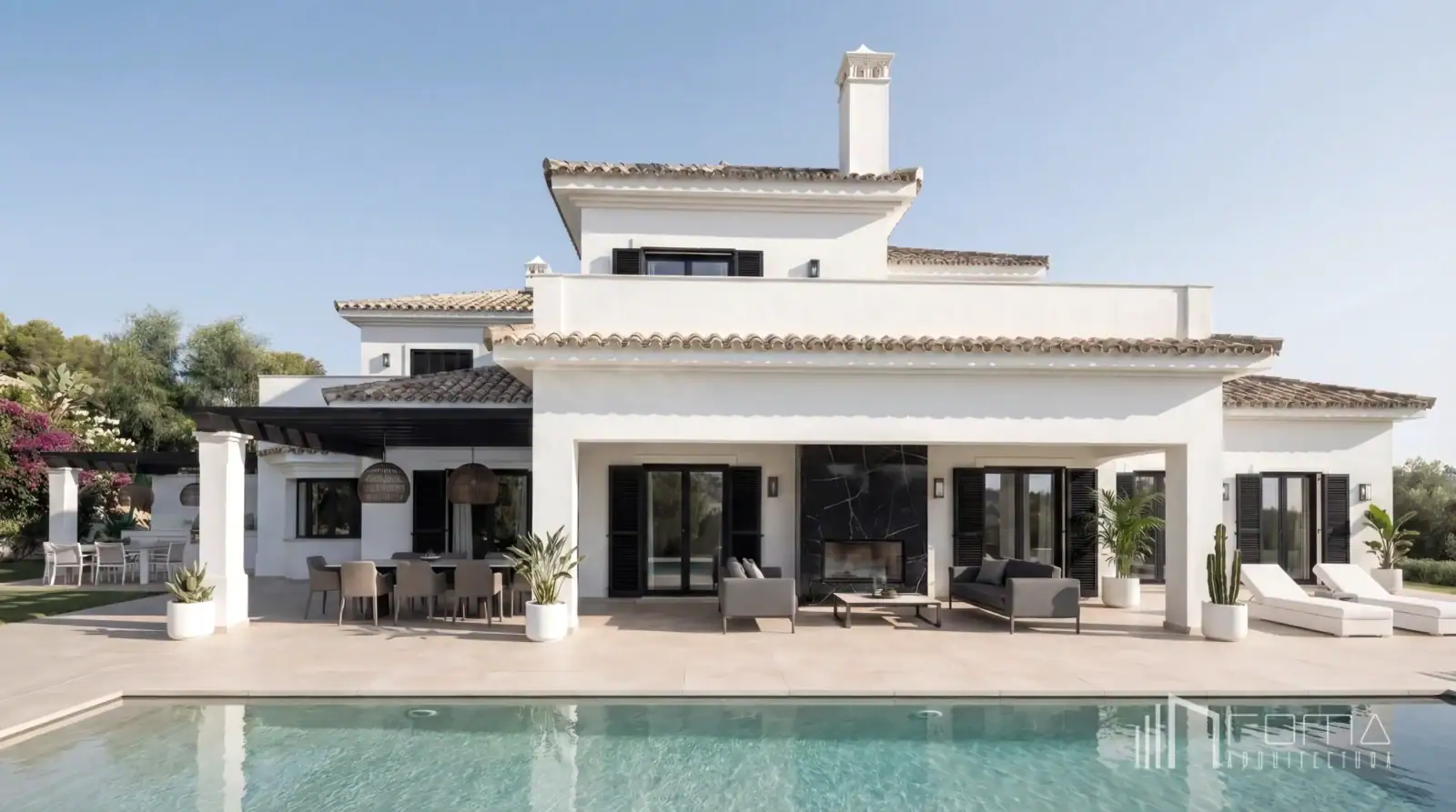 Covered outdoor living porch with black marble fireplace, alfresco dining area, and private swimming pool in la reserva, sotogrande turnkey design projects, designed by roma arquitectura studio.