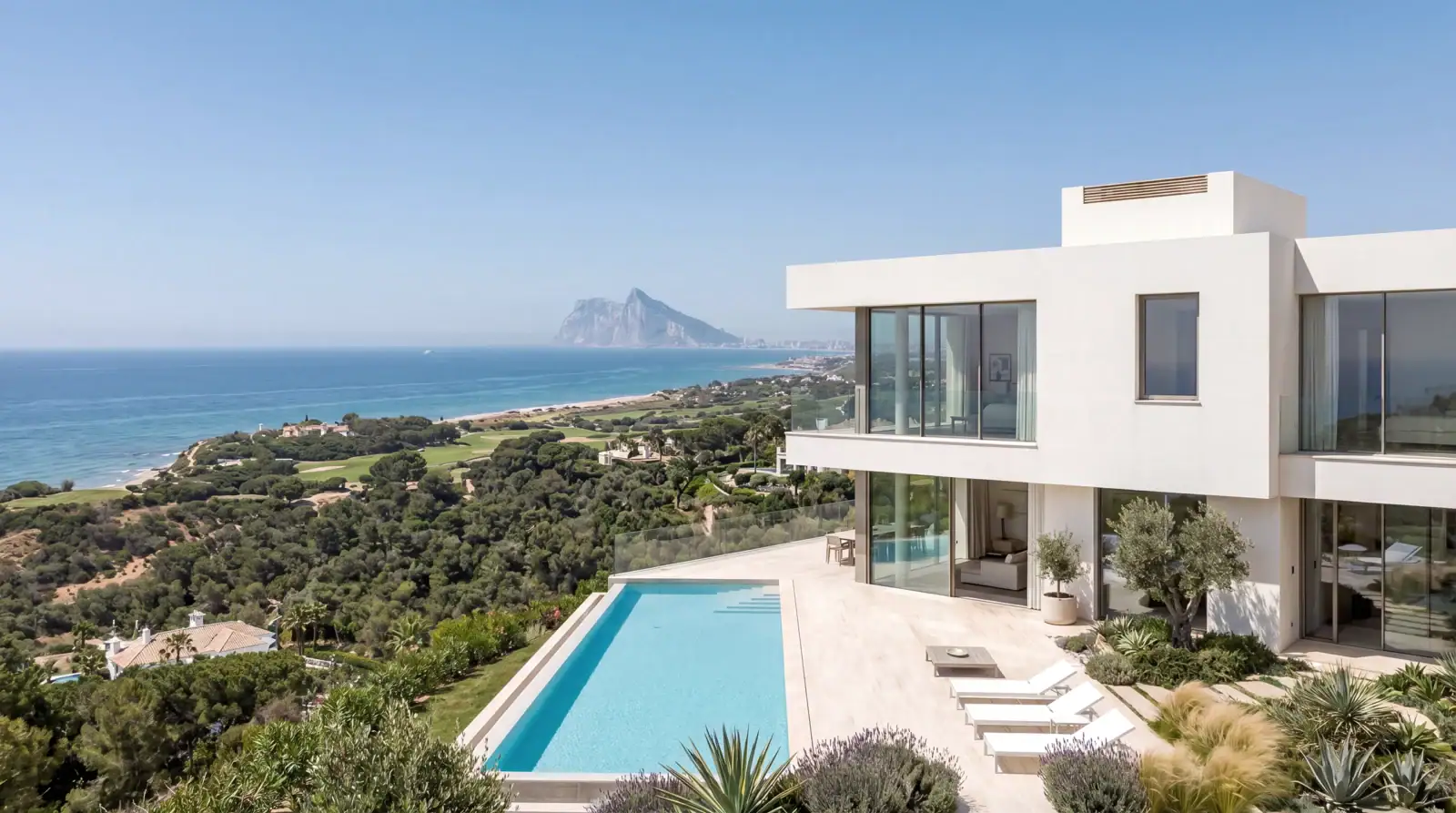 Modern luxury villa with infinity swimming pool overlooking the coast by roma arquitectura studio, premier architects in sotogrande.