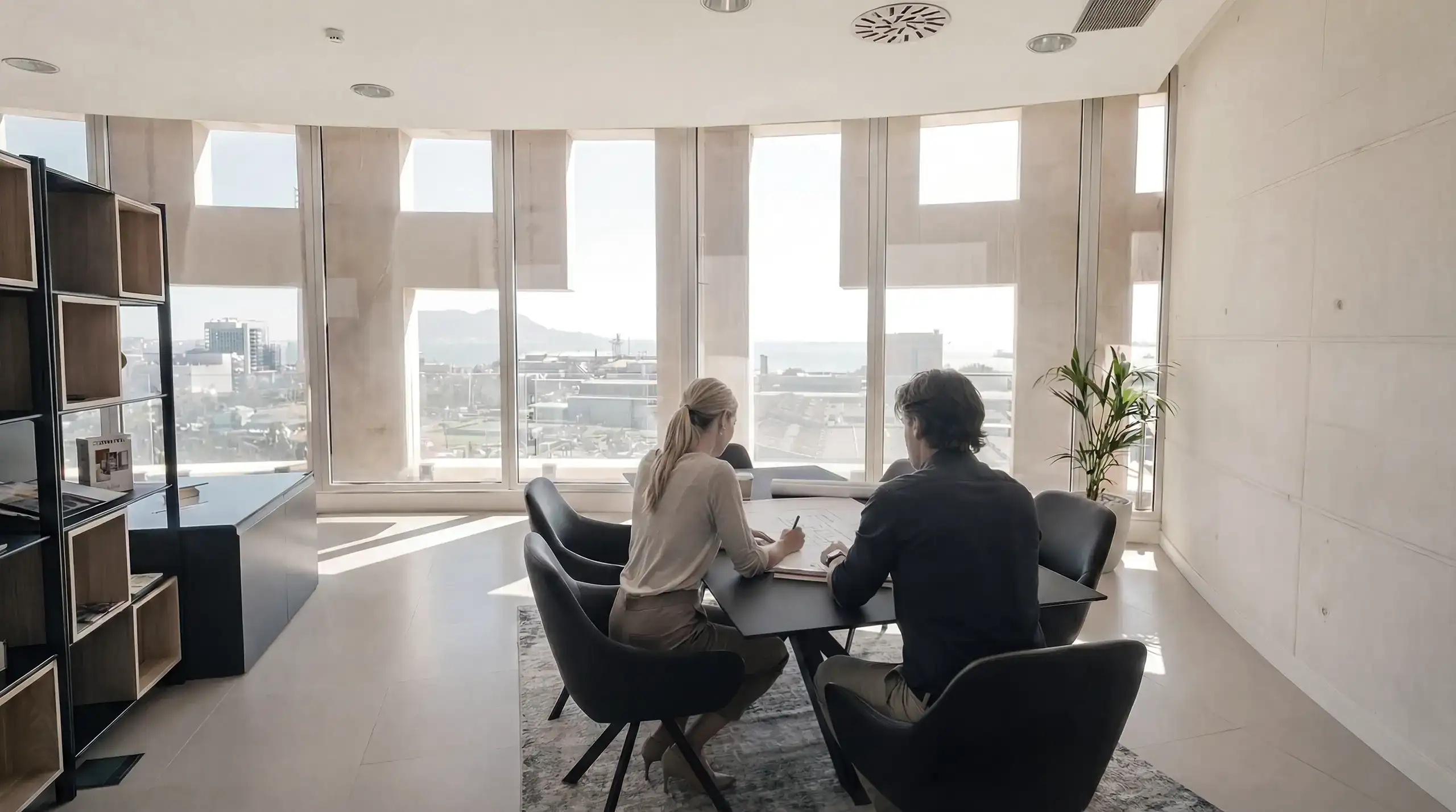 Roma arquitectura studio inside the iconic torres de hercules office, featuring floor-to-ceiling windows with panoramic views of the mediterranean sea
