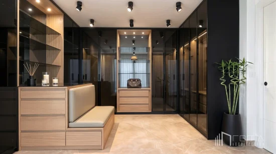 Walk-in dressing room featuring tinted glass wardrobes, bespoke central island, and warm led lighting, sotogrande luxury renovations, crafted by roma arquitectura studio.